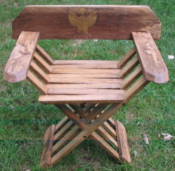 oak folding or x-chair with duck displayed on the back